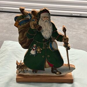 Wooden vintage Santa figure. Beautiful green robes holding a sack of toys!
